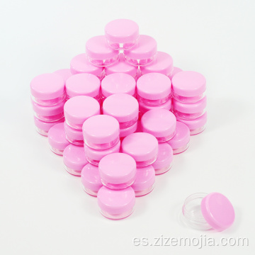 Tarro cosmético de plástico pequeño con tapa rosa